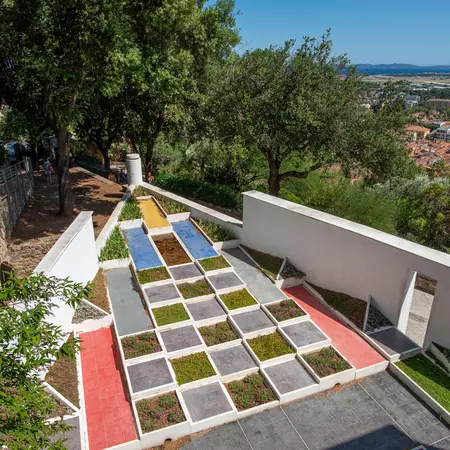 Different colored squares in a garden creates a cubist effect. 