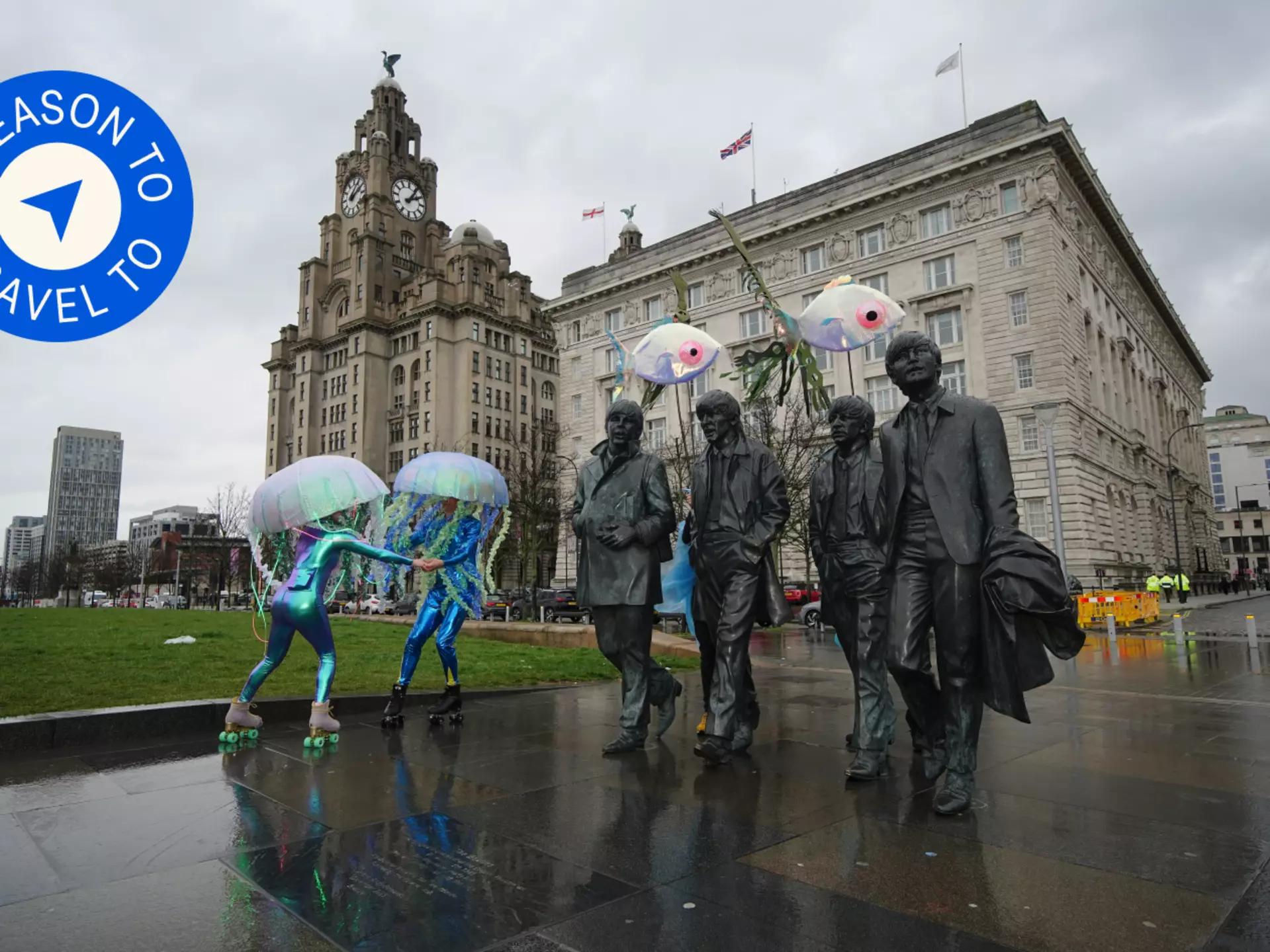 Roller skaters get into the Eurovision spirit next to the famous statue of the Beatles by the Liverpool waterfront © Peter Byrne / PA Images via Getty Images