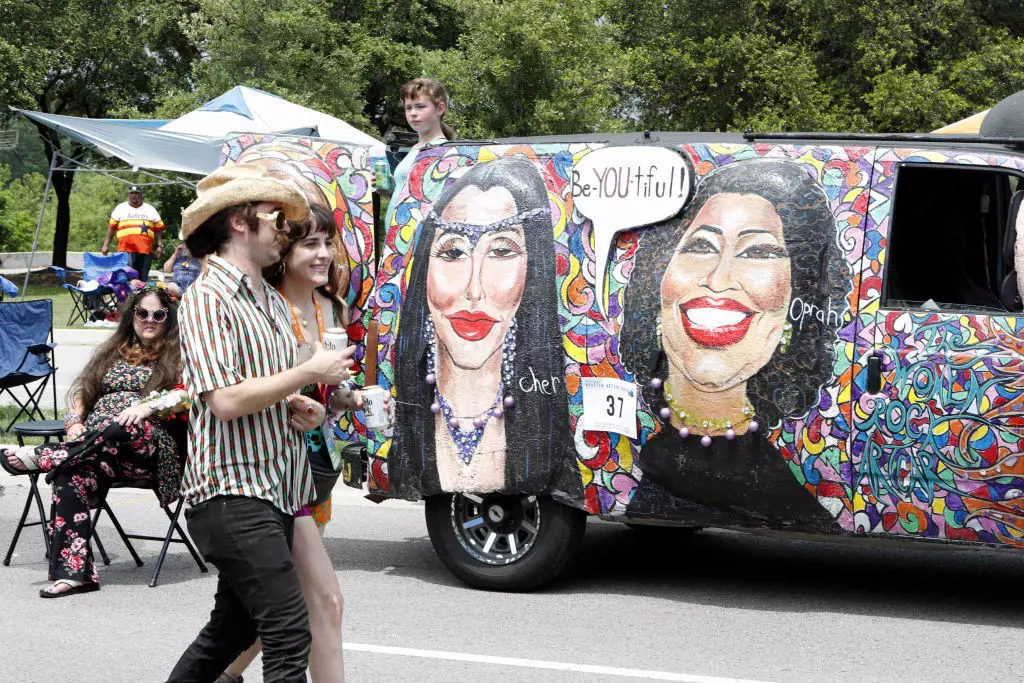 People pass by the mobile masterpiece in Houston, Texas, the United States on April 13, 2019. The 32nd Annual Houston Art Car Parade is the world's oldest and largest Art Car Parade.