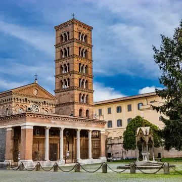 The church, the bell tower, and the liturgical fountain "the Paradise" in the Exarchic Monastery of Saint Mary in Grottaferrata, Greek Abbey of Saint Nilus, the last Byzantine-Greek monastery in Italy; Shutterstock ID 1249634503;