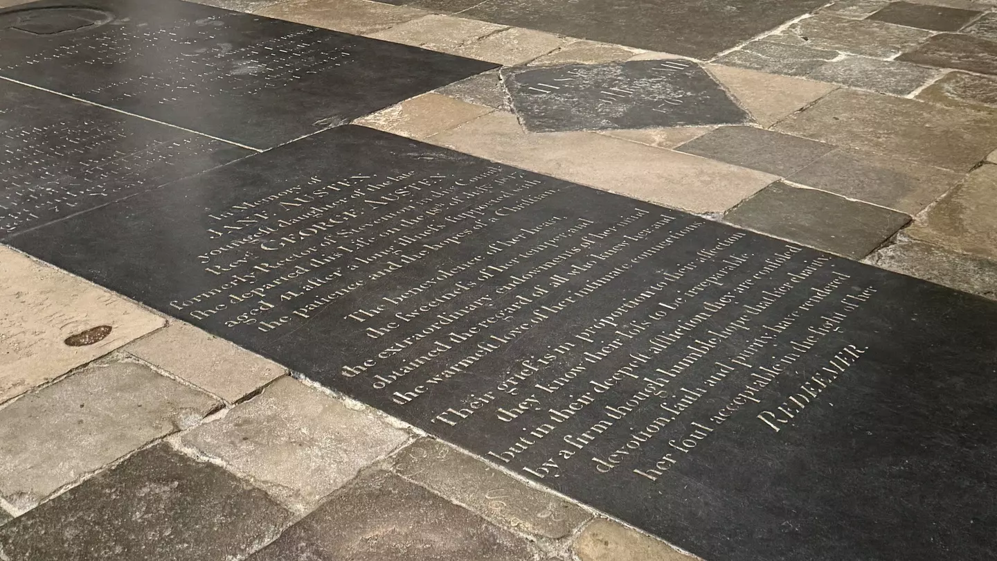 A stone floor panel with writing inscribed on it.