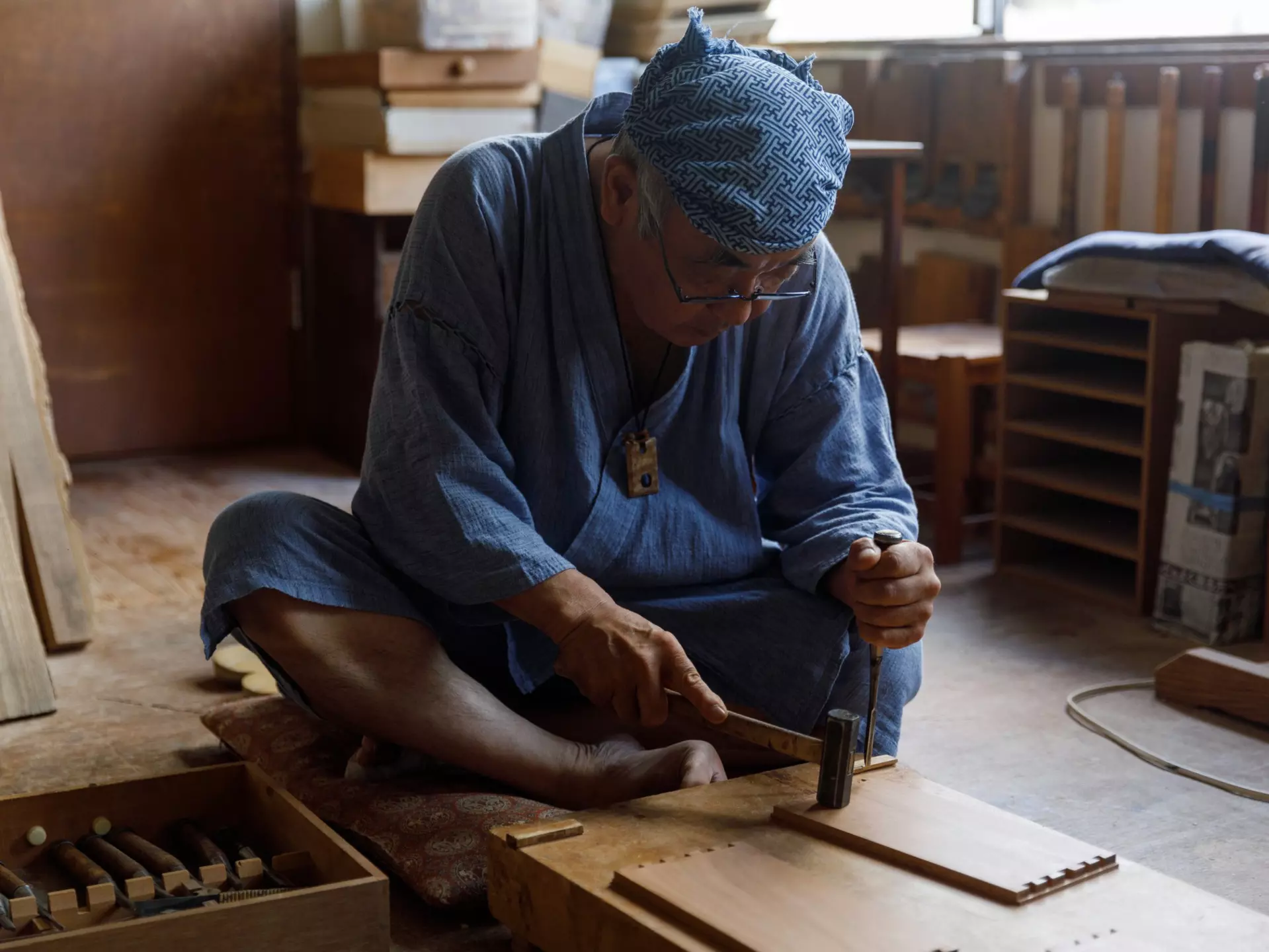 A Japanese artisan uses traditional woodworking methods. Courtesy of Wabunka