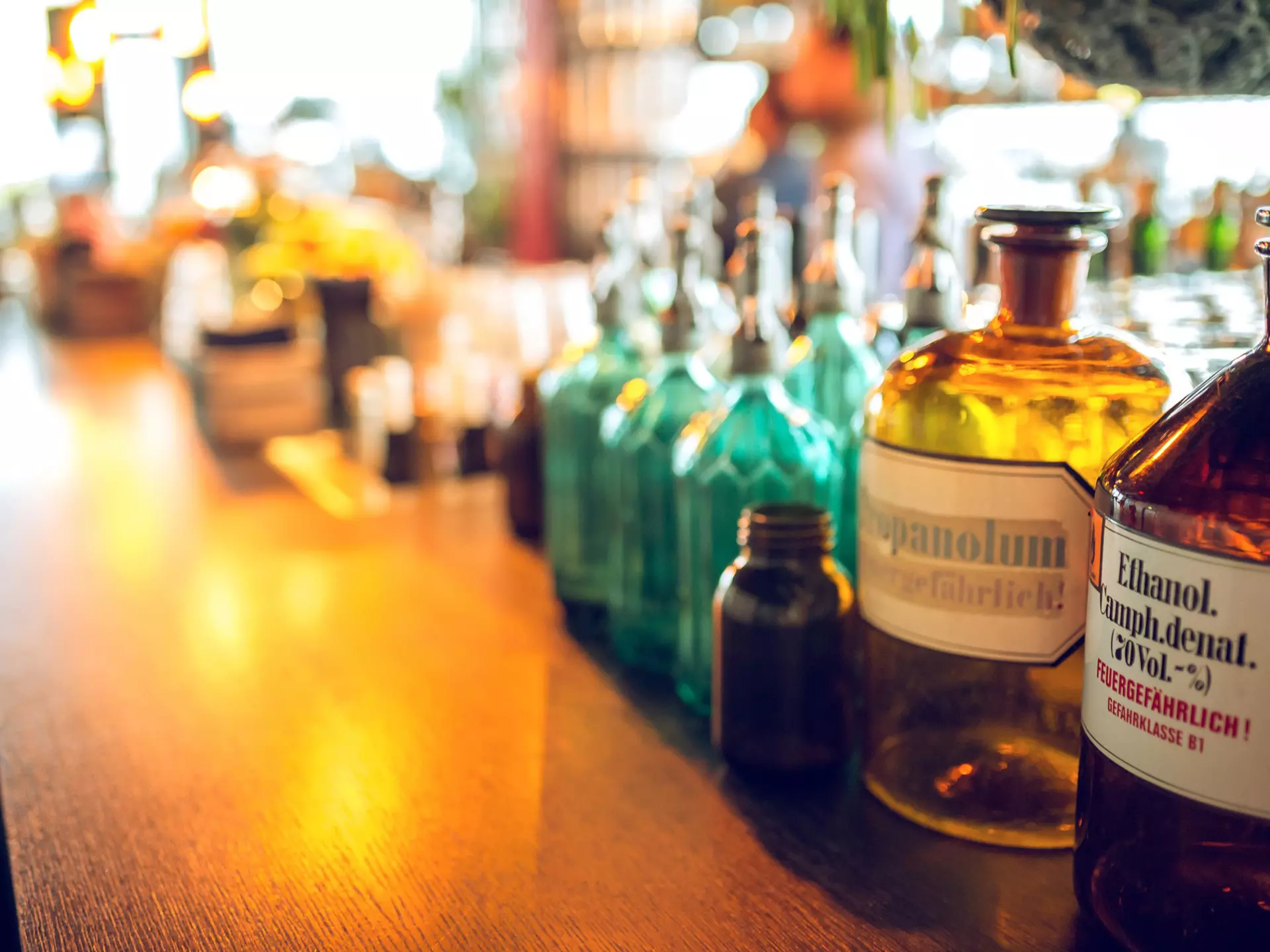 A red topped waiter serves a Satan white beer from the 'De Block' breewery in the pub 'Family Brews' in the Rue des Harengs in Brussels, Belgium.