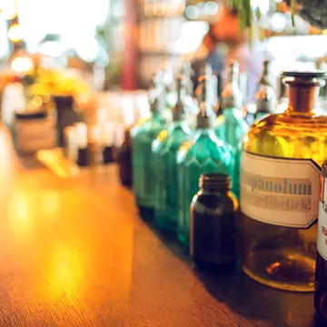 A red topped waiter serves a Satan white beer from the 'De Block' breewery in the pub 'Family Brews' in the Rue des Harengs in Brussels, Belgium.
