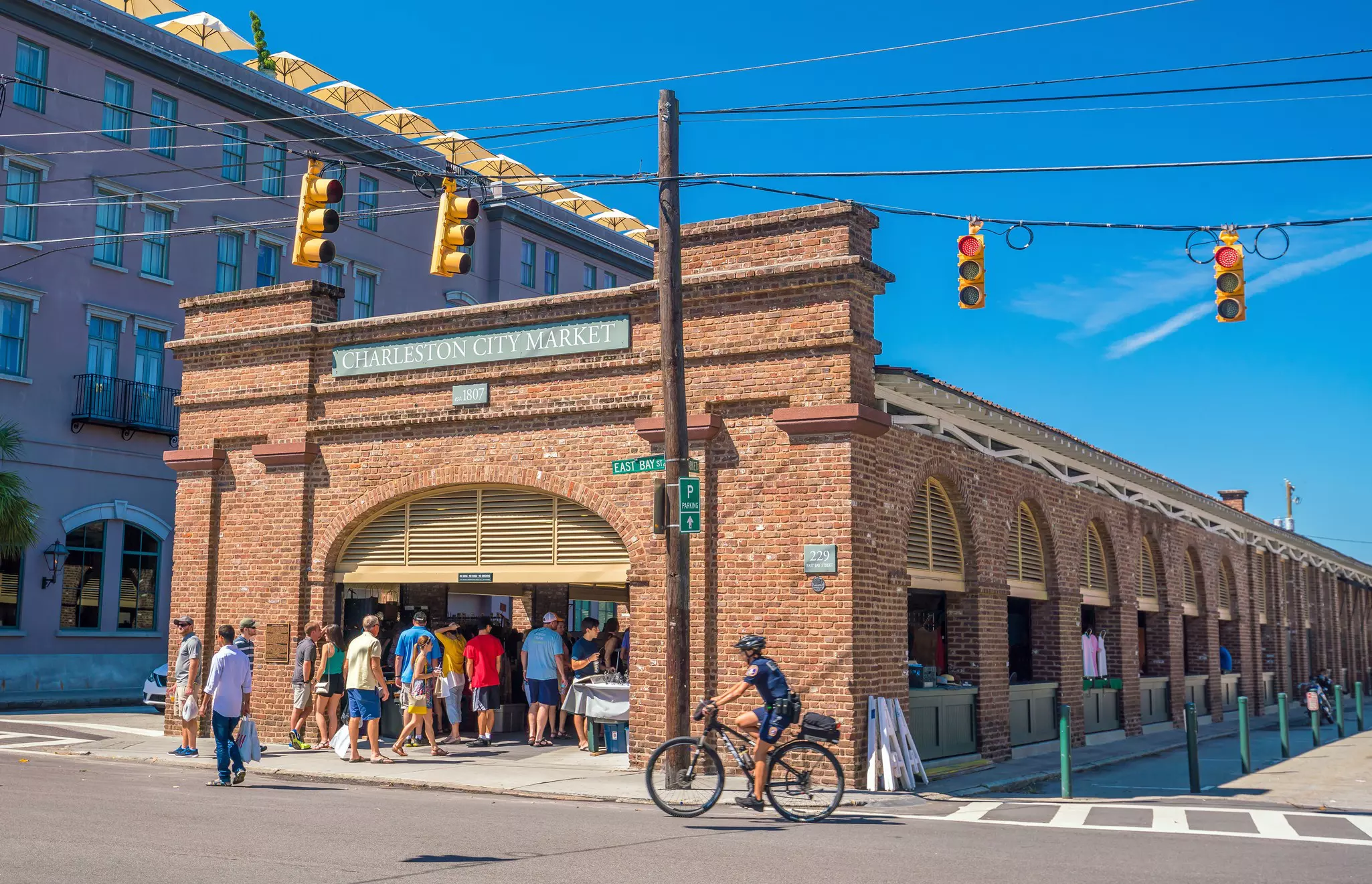 People queue to get into the historic Charleston City Market in Charleston, South Carolina.