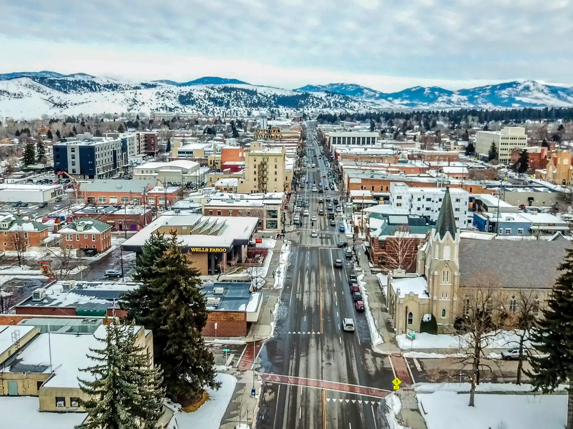 Aerial view of Main Street in Bozeman Montana with a snowy surrounding landscape