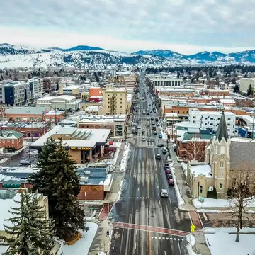 Aerial view of Main Street in Bozeman Montana with a snowy surrounding landscape