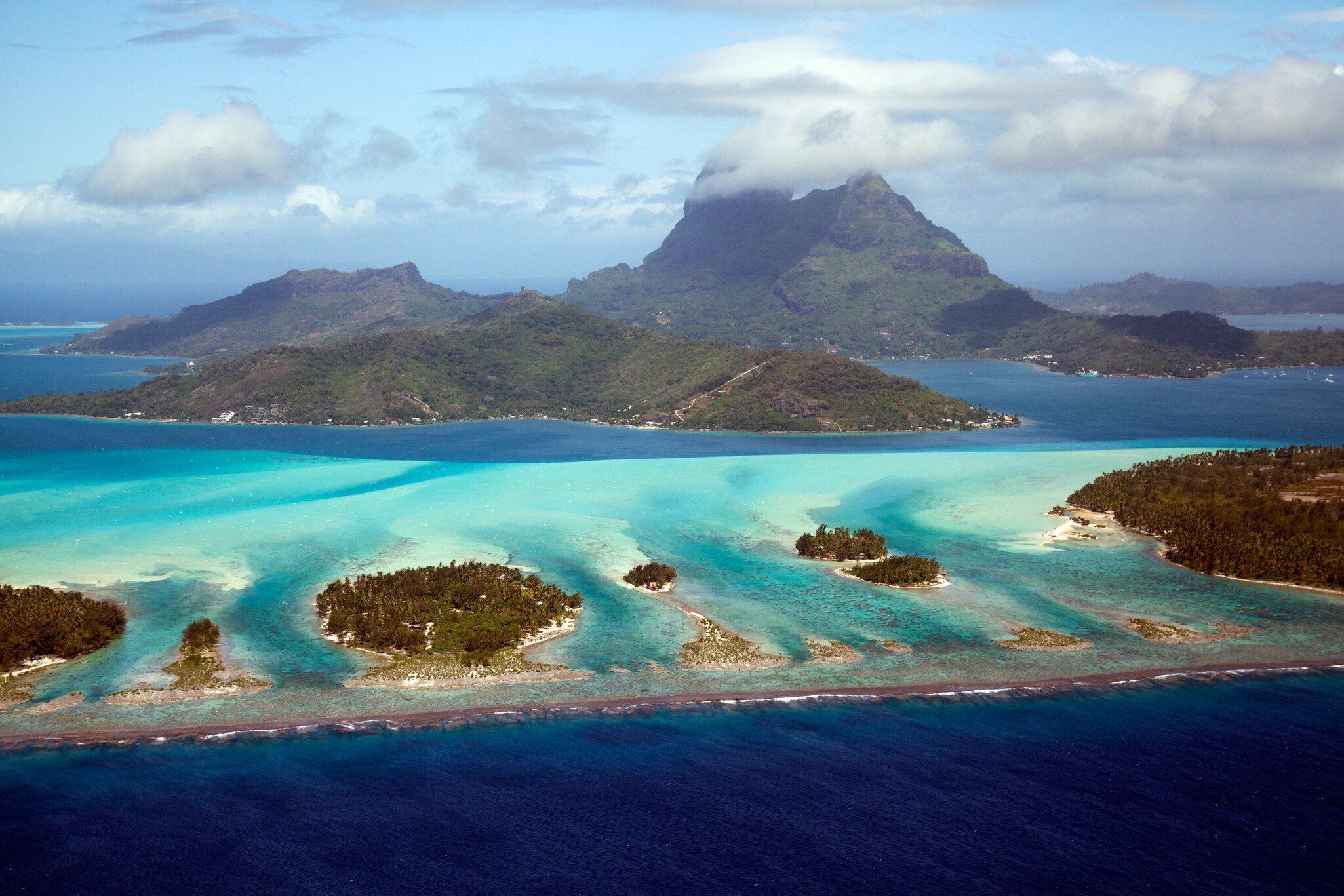 Aerial view of Bora Bora with Mount Otemanu, Mount Pahia , and the surrounding motus.
helicopter, lagoon, paradise, aerial photography, french polynesia, bora bora, mount otemanu, otemanu, mount pahia, leeward islands, frederick millett, frederick millett photography, pahia, bora bora french polynesia, fcm photography, island vacation