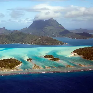 Aerial view of Bora Bora with Mount Otemanu, Mount Pahia , and the surrounding motus.
helicopter, lagoon, paradise, aerial photography, french polynesia, bora bora, mount otemanu, otemanu, mount pahia, leeward islands, frederick millett, frederick millett photography, pahia, bora bora french polynesia, fcm photography, island vacation
