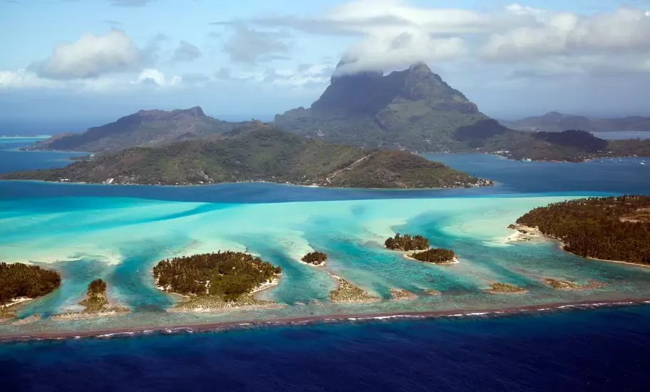 An island surrounded by islets within a lagoon