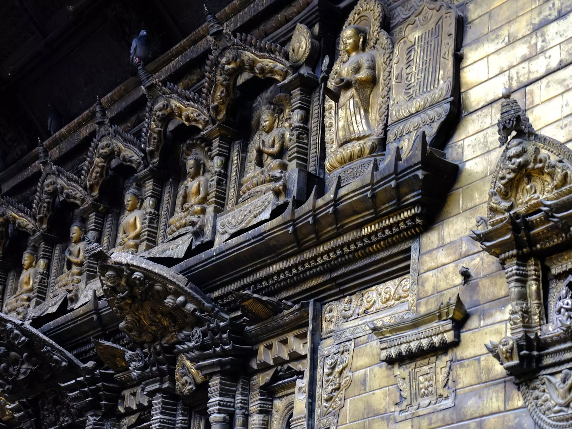 Gilded panels on the Hiranya Varna Mahavihar (Golden Temple) in Patan, Nepal. 