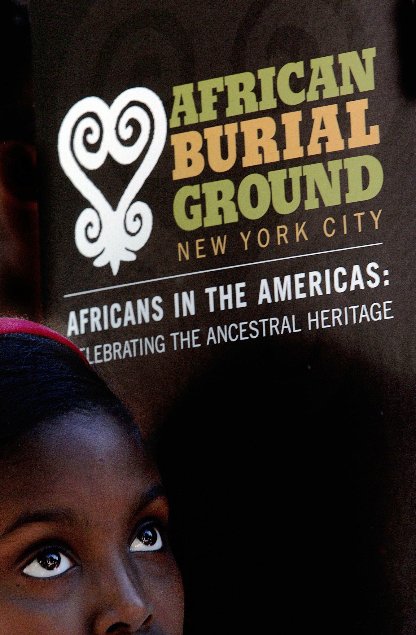 NEW YORK - SEPTEMBER 30: A school child listens to a speaker during a ceremony at the African Burial Ground September 30, 2005 in New York City. Hundreds of school children attended the tribute ceremony at the African Burial Ground, a final restin...