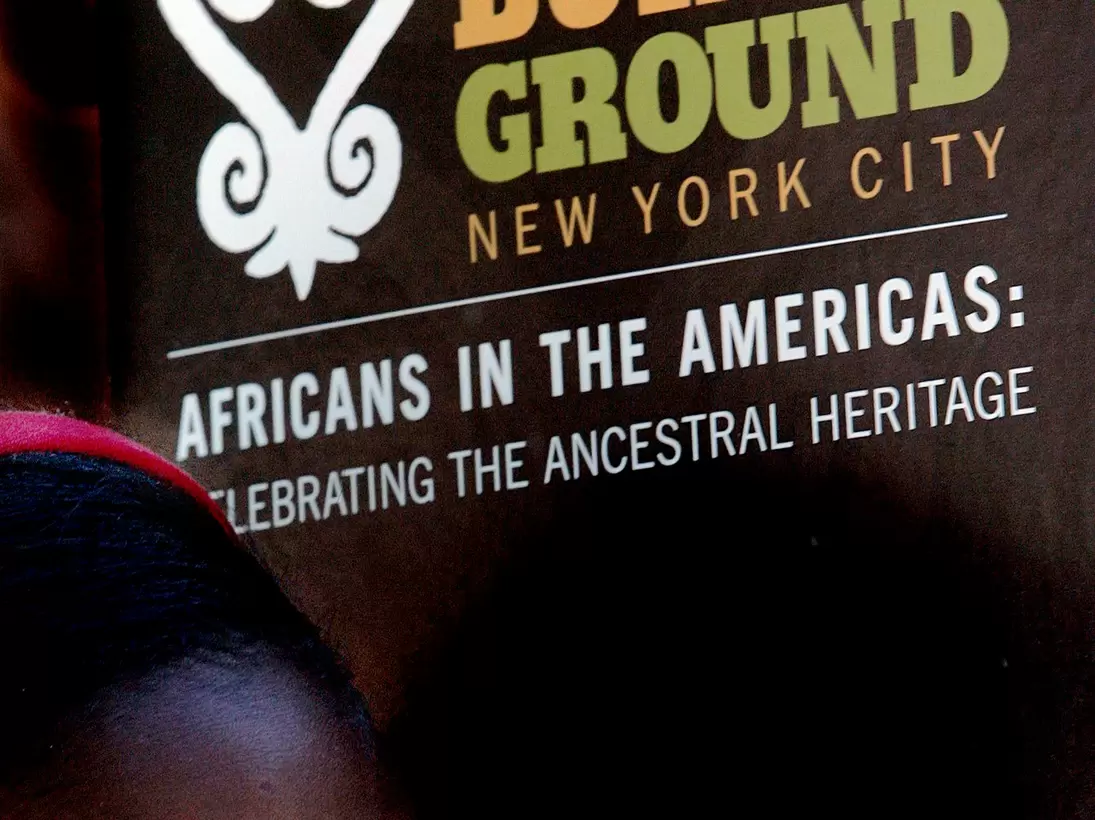 NEW YORK - SEPTEMBER 30: A school child listens to a speaker during a ceremony at the African Burial Ground September 30, 2005 in New York City. Hundreds of school children attended the tribute ceremony at the African Burial Ground, a final restin...