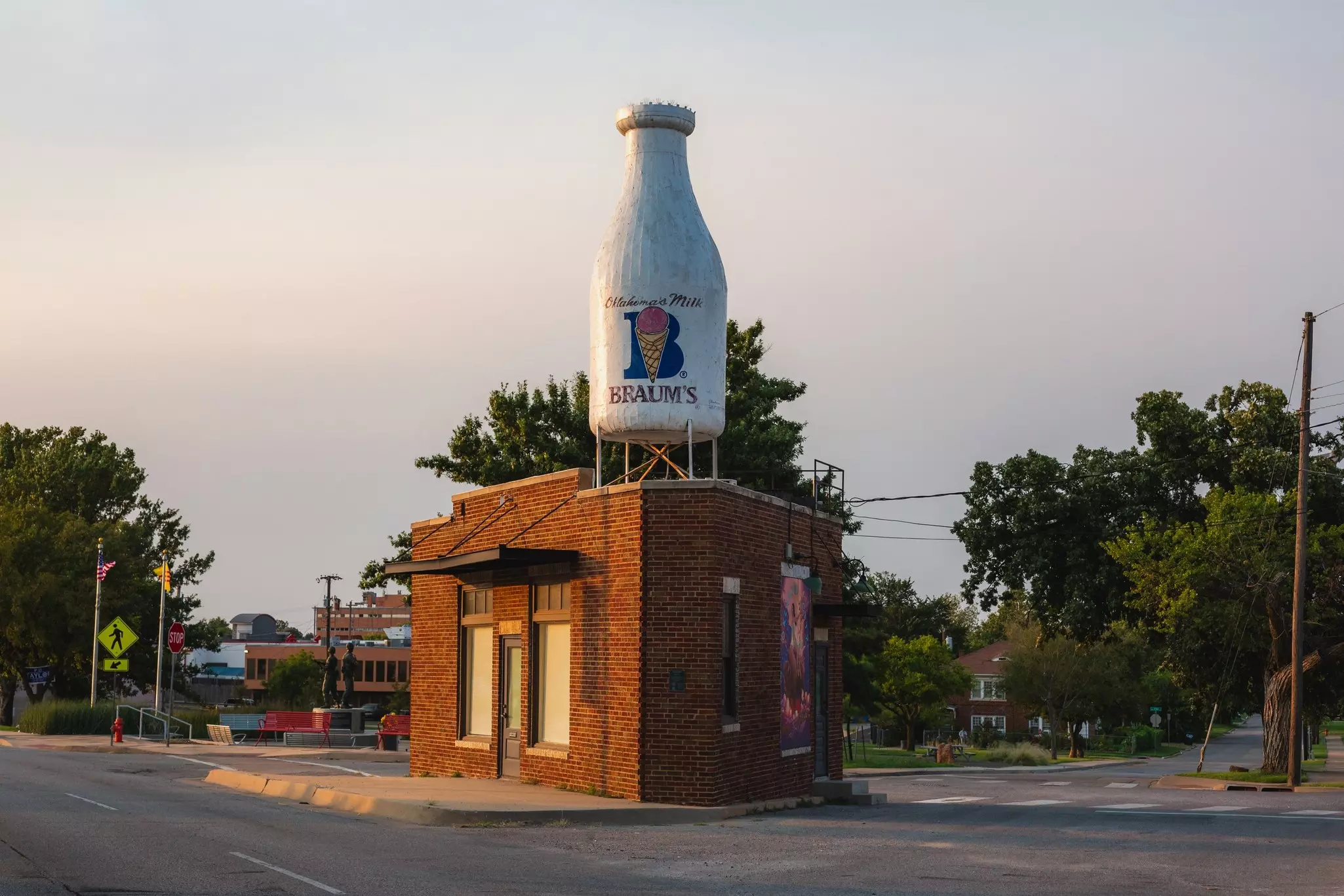 A small brick building with a milk bottle on the roof in Oklahoma City, OK