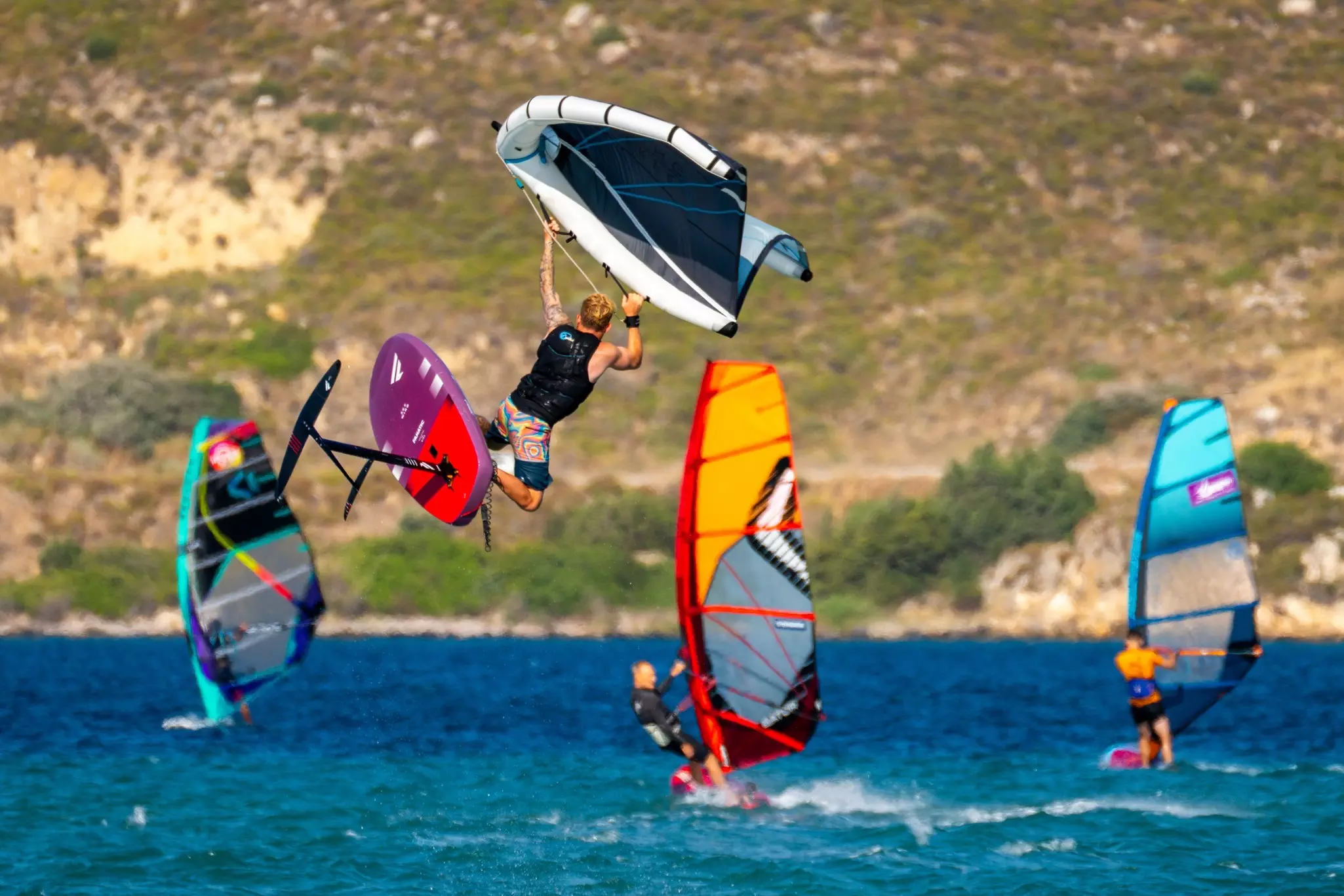 Windsurfers enjoy the powerful winds at Alacati, Turkey.