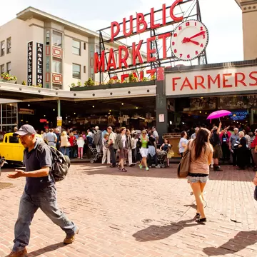 A crowd of people heading in and out of Seattle's Pike Place market