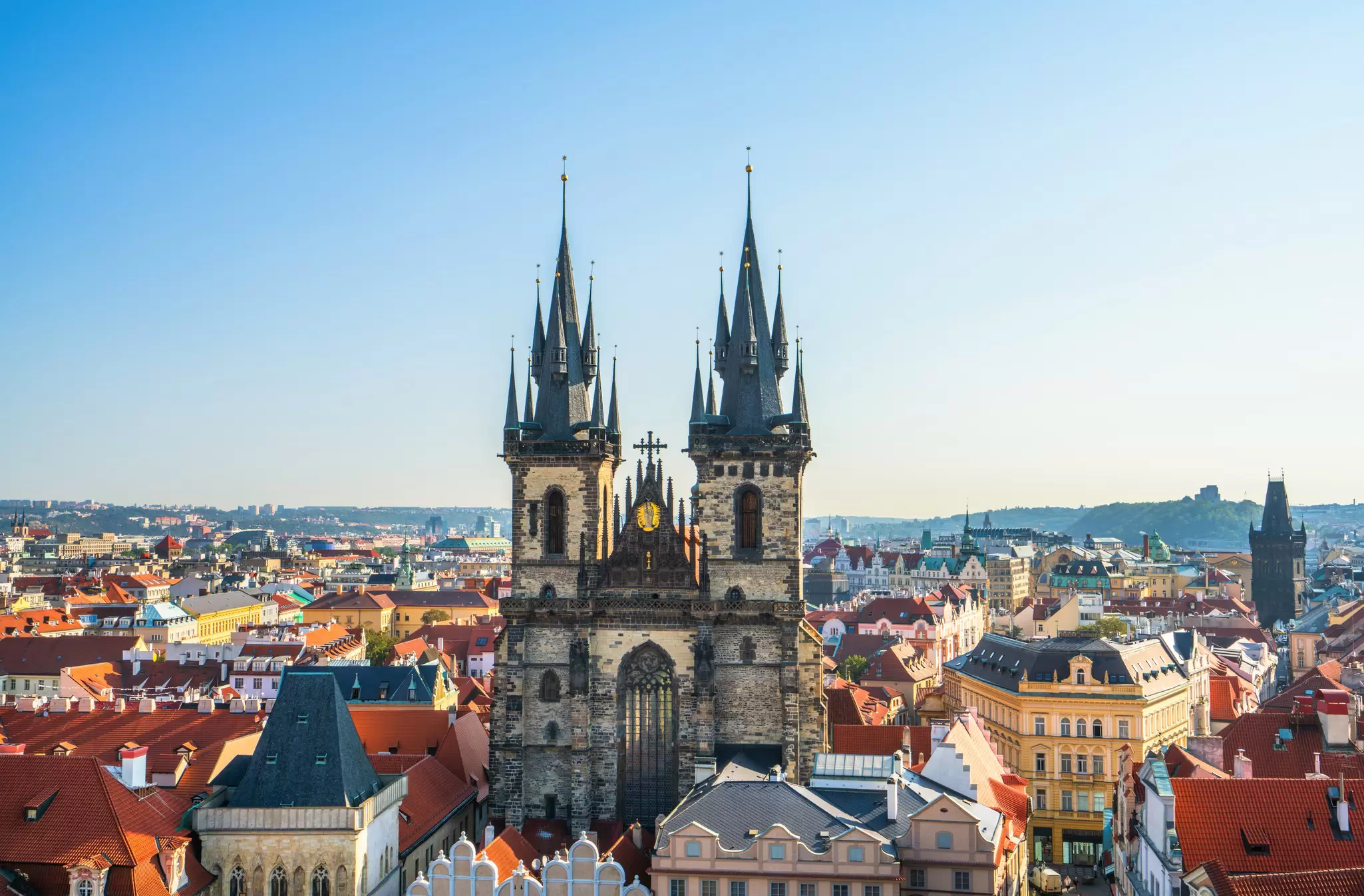 View of the twin spires of the Church of Our Lady Before Týn on a sunny day in Prague, Czechia.
