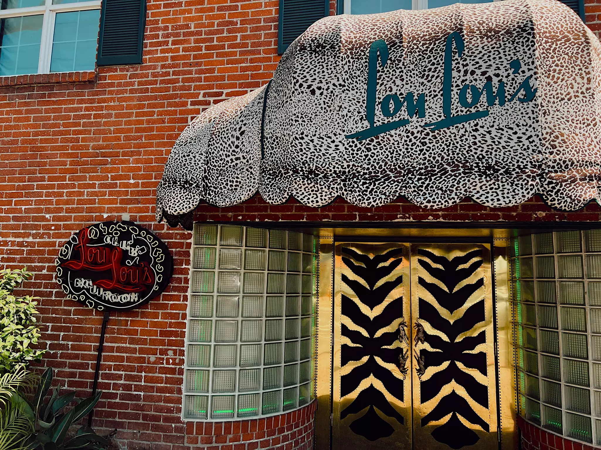 The animal print awning and tiger print doors of Lou Lou's Jungle Room in San Diego, California.