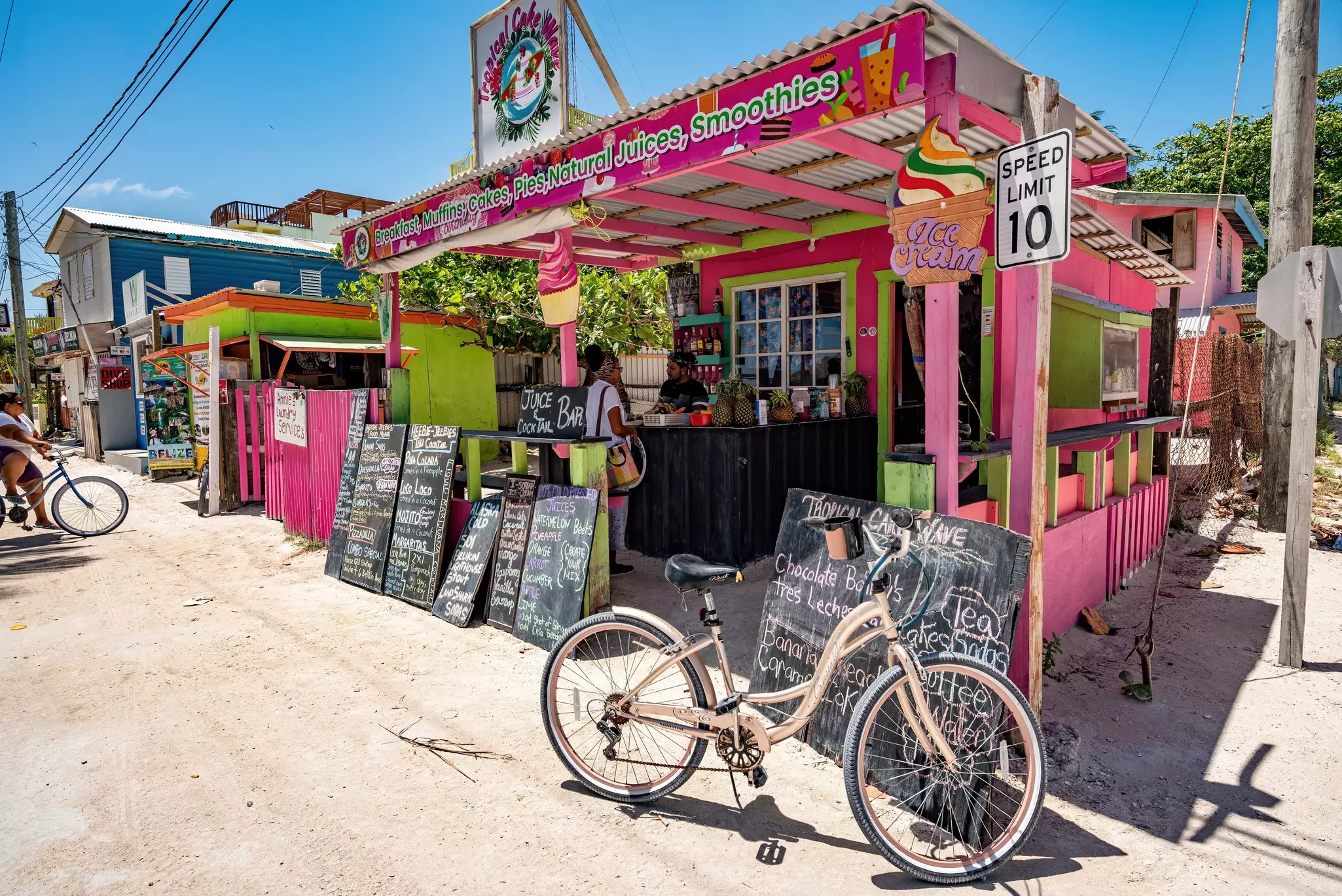 Bicycle parked outside a colorful streetside cafe and juice bar on the laid-back Caribbean island of Caye Caulker in Belize.