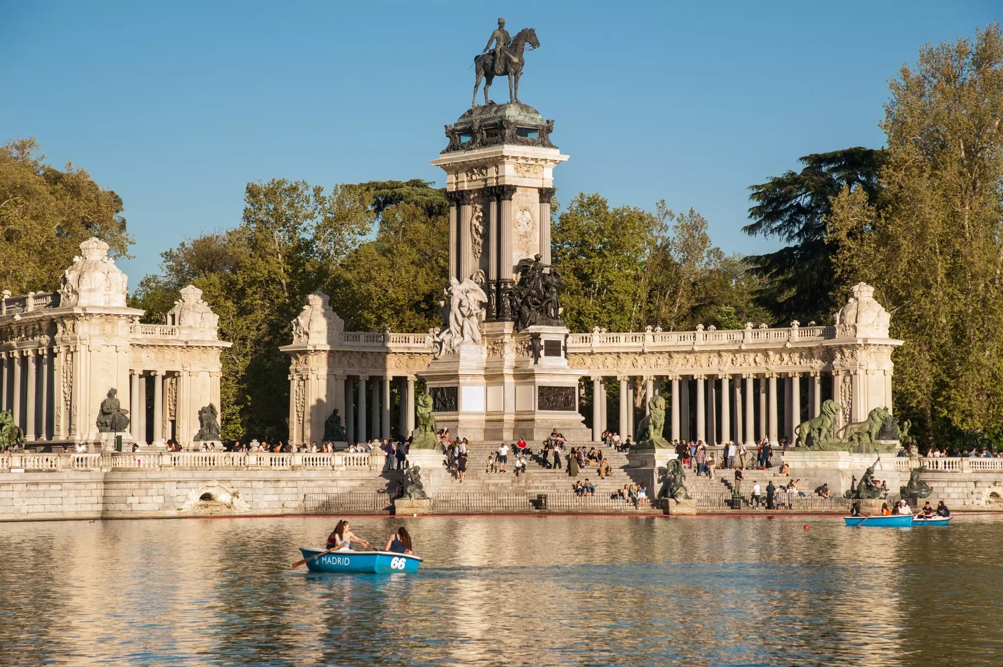 Natural landscape, large lake and historic monument to Alfonso XII, in Parque del Retiro, Madrid