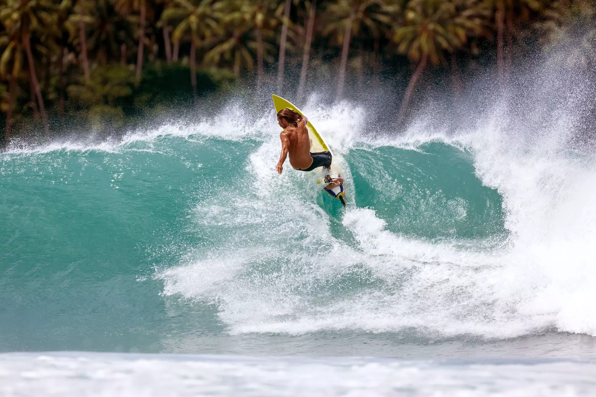 Indonesia, North Sumatra, Nias, surfing at Lagundri Bay.