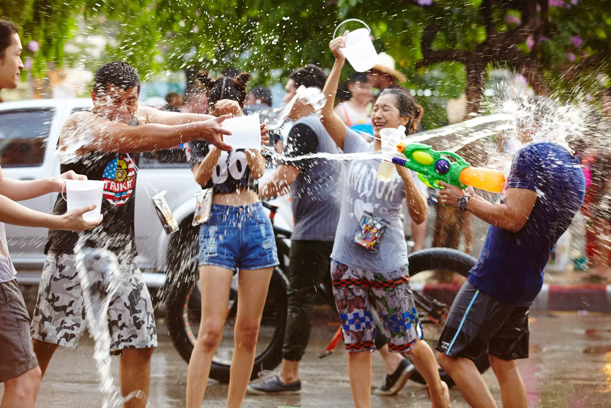 People soaking each other with water during the Songkran Festival in Chiang Mai, Thailand.