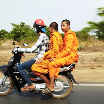 Motorcycle taxis cover short routes in Cambodia. Mark Read for Lonely Planet