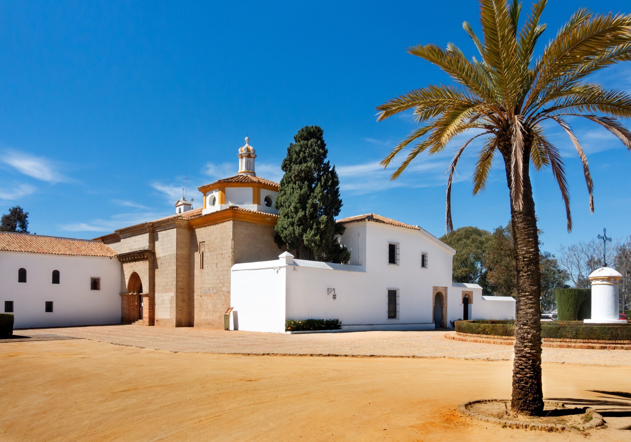 Exterior view of the Monasterio de la Rábida on a sunny day in Palos de la Frontera, Huelva, Spain.