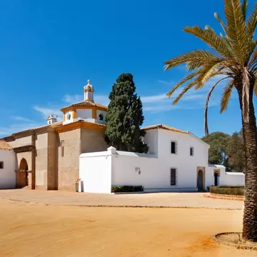 Exterior view of the Monasterio de la Rábida on a sunny day in Palos de la Frontera, Huelva, Spain.