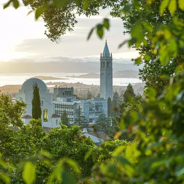 Beautiful view of Berkeley Skyline, including Sather Tower, or Campanile, and International House, with San Francisco Bay in the background.