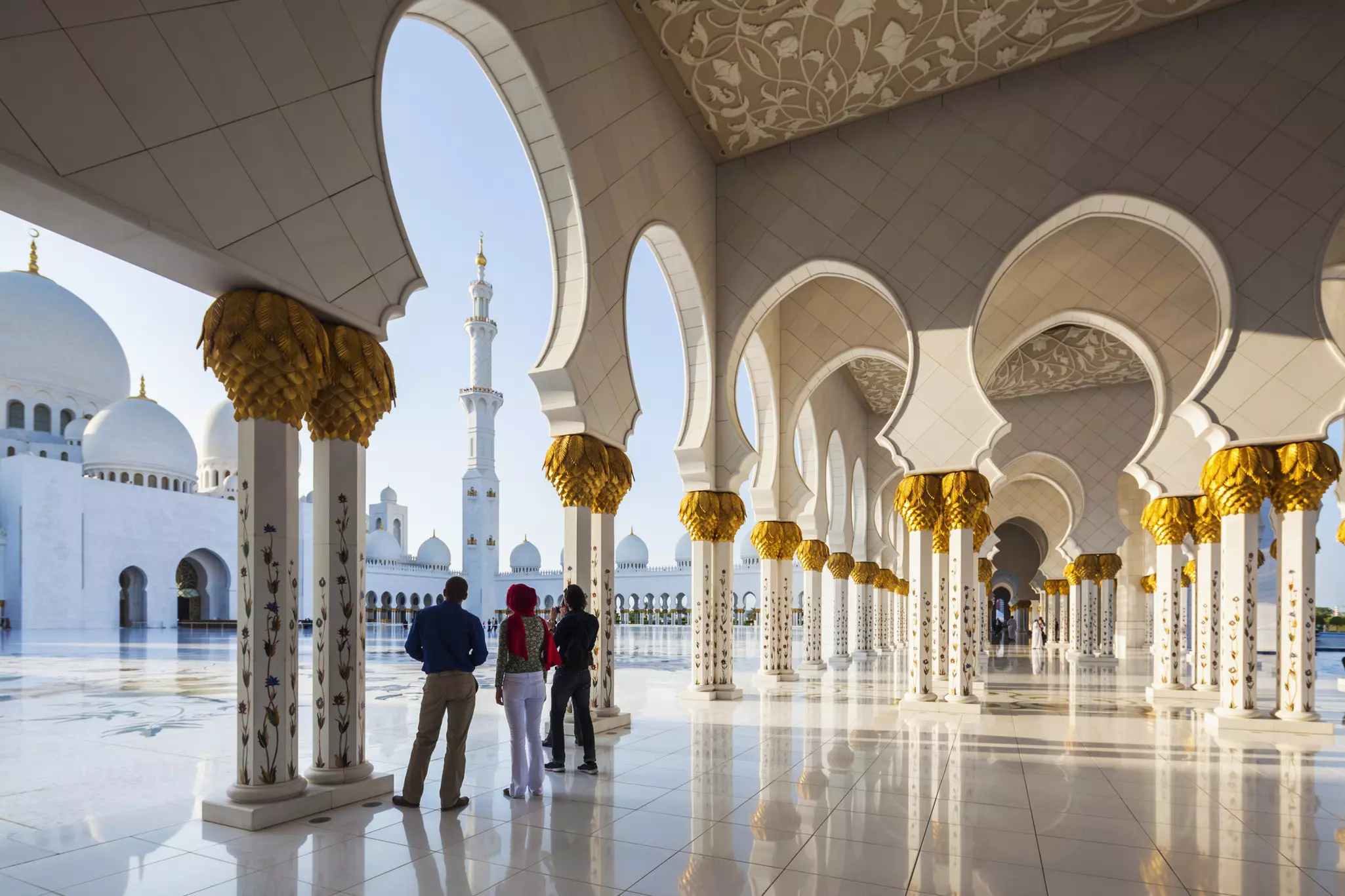 It's best to prepare kids on the etiquette for visiting religious sites like Sheikh Zayed Grand Mosque © Walter Bibikow / Getty Images