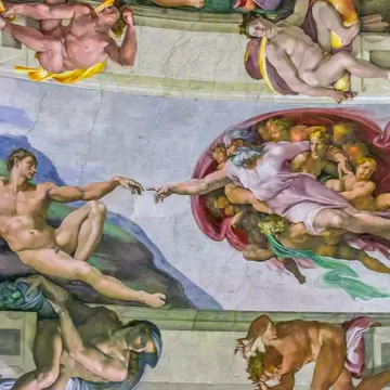 Michelangelo's fresco of God reaching out to touch Adam's finger on the Sistine Chapel ceiling