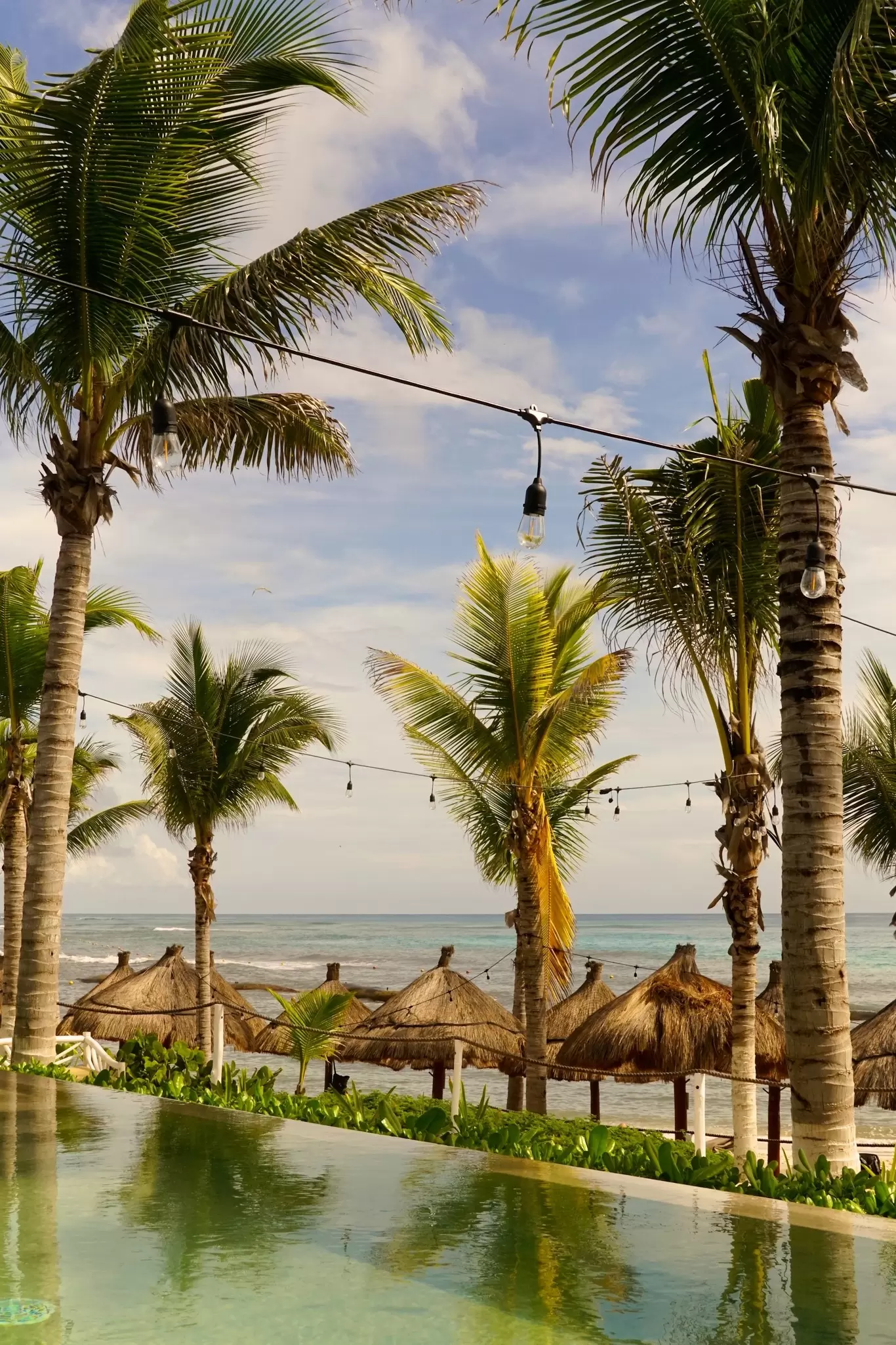 View of the beach and sea by the ancient ruins in Parque del Jaguar, Mexico.