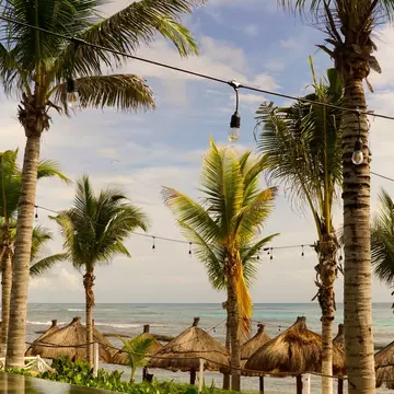 View of the beach and sea by the ancient ruins in Parque del Jaguar, Mexico.