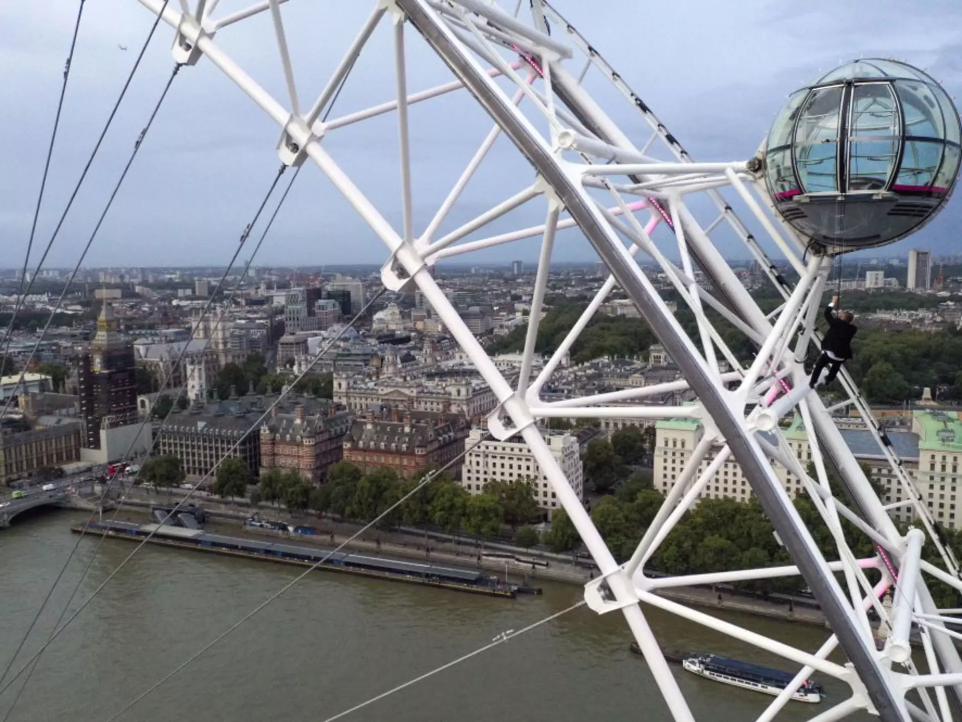 A man dressed as Britain's most famous secret service agent, James Bond, is silhouetted against the London skyline as he climbs the outside of a pod on the lastminute.com London Eye, the landmark tourist attraction in central London, ahead of the world premiere of No Time To Die, the latest instalment in the Bond franchise. Picture date: Tuesday September 28, 2021. (Photo by Steve Parsons/PA Images via Getty Images)
1235547302