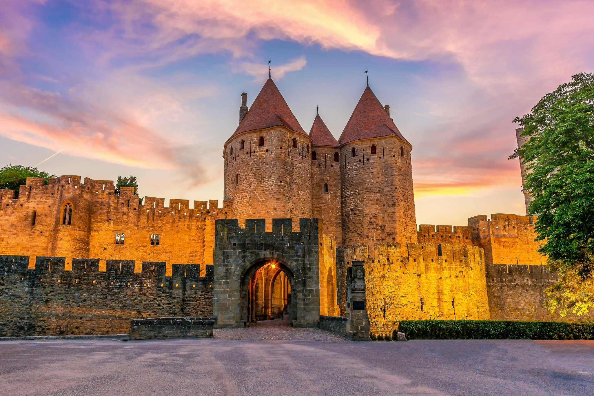 Night view of Carcassone medieval city in France against dramatic sunset sky ; Shutterstock ID 2280924097;