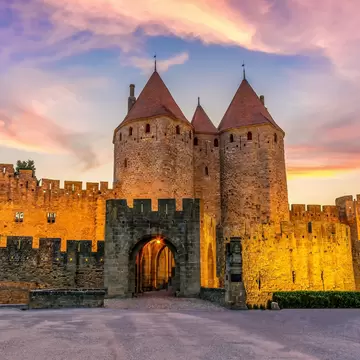 Night view of Carcassone medieval city in France against dramatic sunset sky ; Shutterstock ID 2280924097;