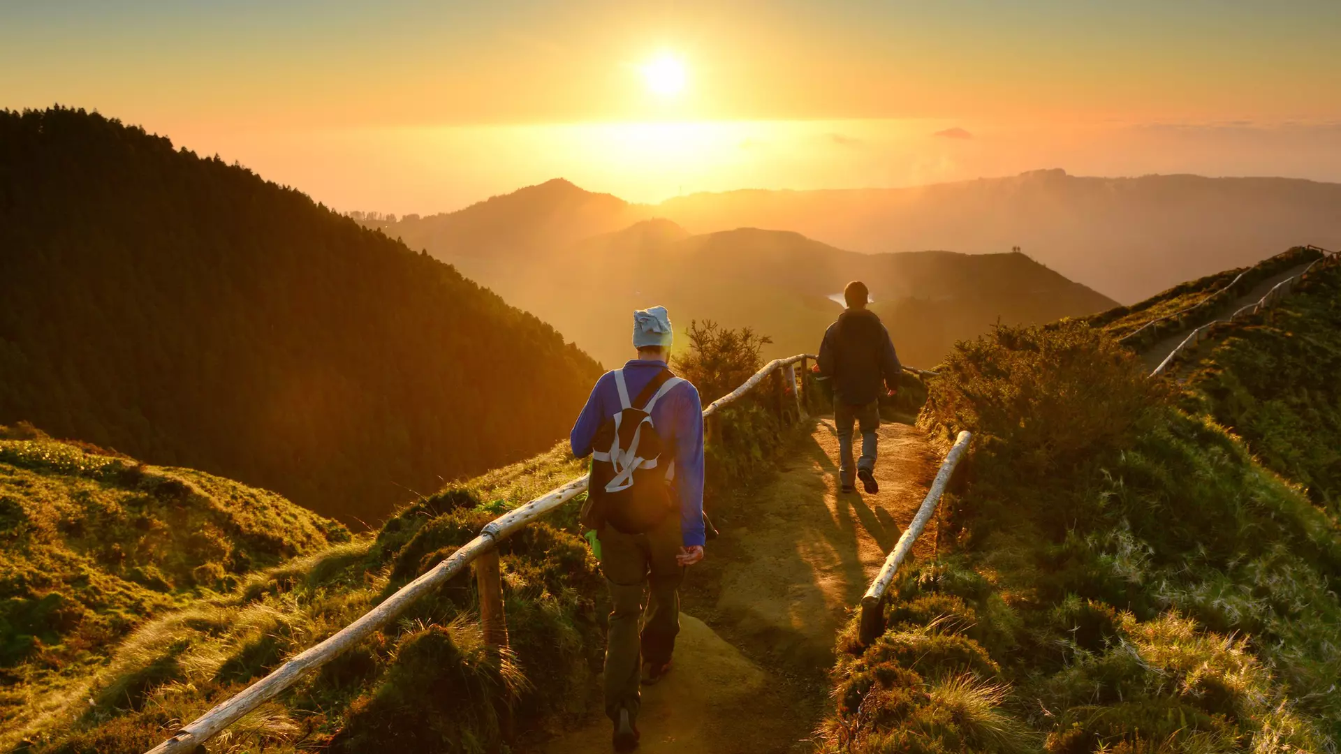 Friends walking at sunset at Sete Cidades lakes, Sao Miguel island, Azores