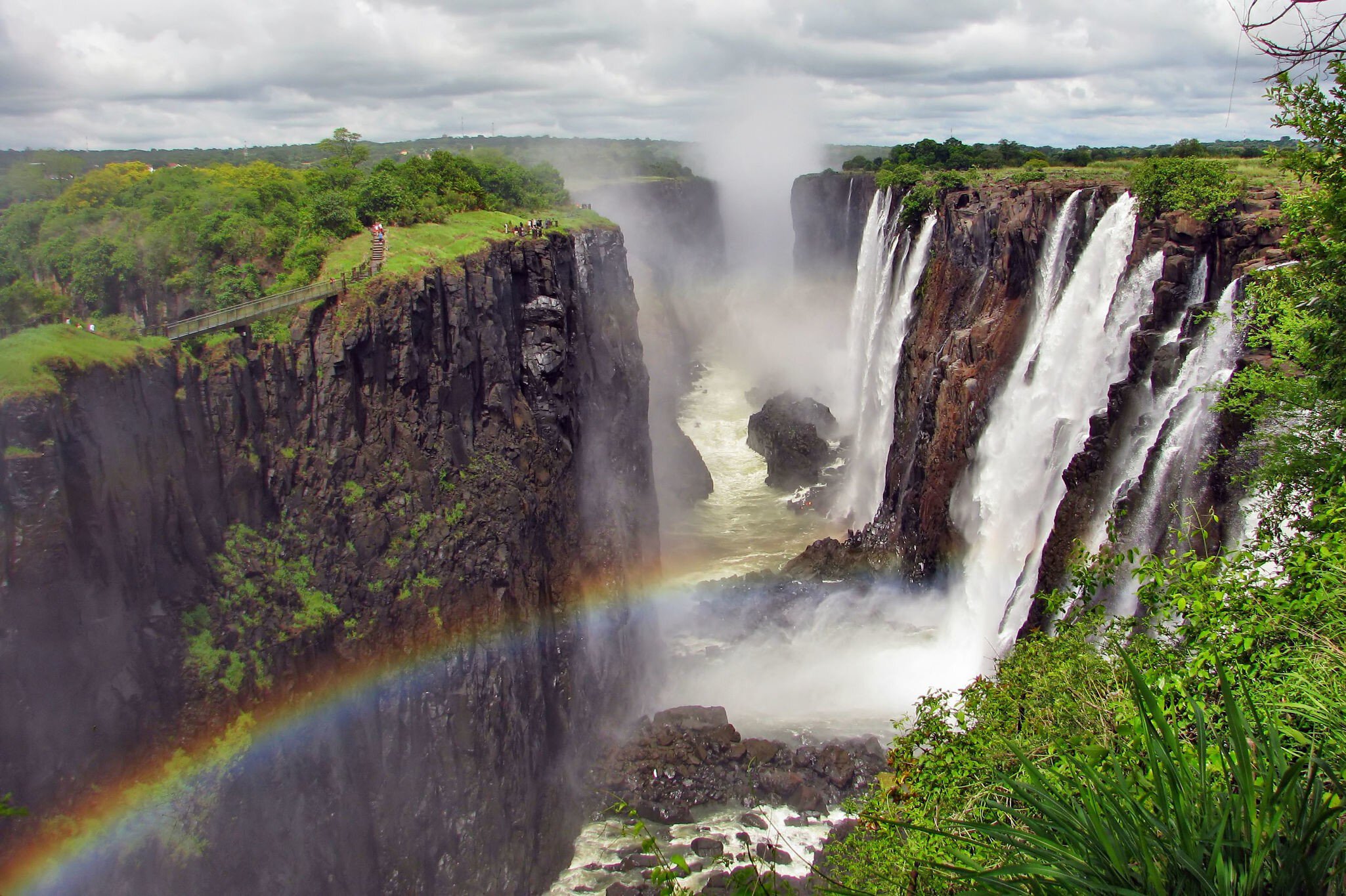Rainbow over Victoria Falls on Zambezi River, border of Zambia and Zimbabwe
148399298
africa, african, amazing, beauty, big, blue, brown, clean, clouds, destinations, ecology, environment, falls, famous, flow, green, landscape, large, livingstone, majestic, mist, national, natural, nature, overcast, park, power, rainbow, rainforest, river, scene, scenic, sightseeing, sky, splash, stormy, strength, tourism, tropical, valley, victoria, view, water, waterfall, wild, wilderness, wonder, zambezi, zambia, zimbabwe