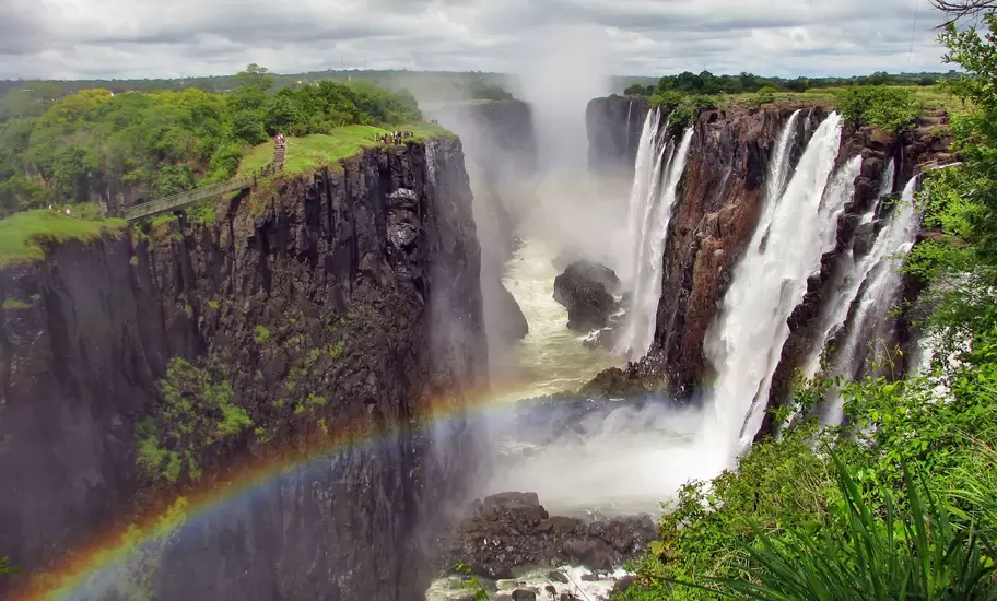 Rainbow over Victoria Falls on Zambezi River, border of Zambia and Zimbabwe
148399298
africa, african, amazing, beauty, big, blue, brown, clean, clouds, destinations, ecology, environment, falls, famous, flow, green, landscape, large, livingstone, majestic, mist, national, natural, nature, overcast, park, power, rainbow, rainforest, river, scene, scenic, sightseeing, sky, splash, stormy, strength, tourism, tropical, valley, victoria, view, water, waterfall, wild, wilderness, wonder, zambezi, zambia, zimbabwe