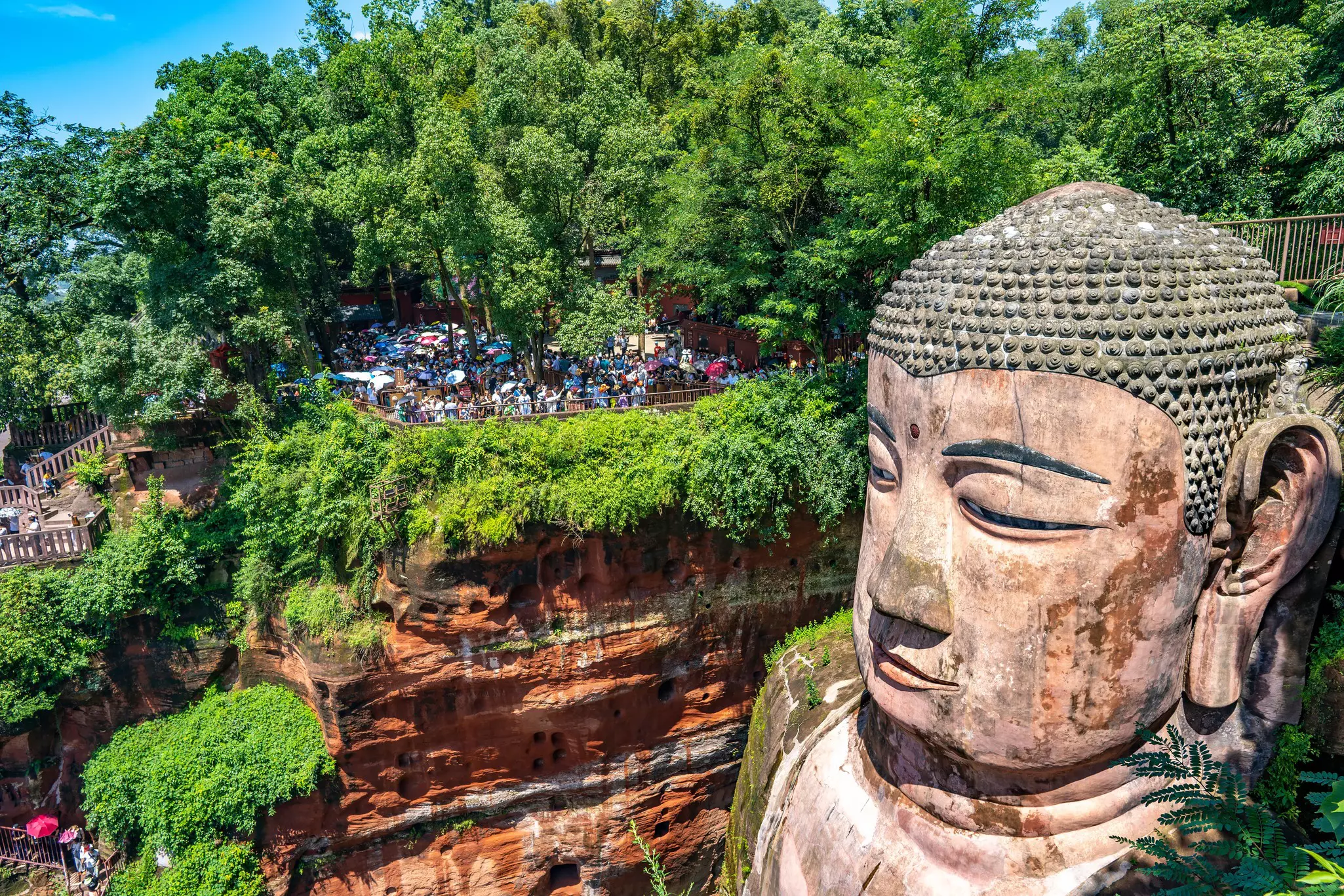 Tourists viewing the head of the Le Shan Grand Buddha
