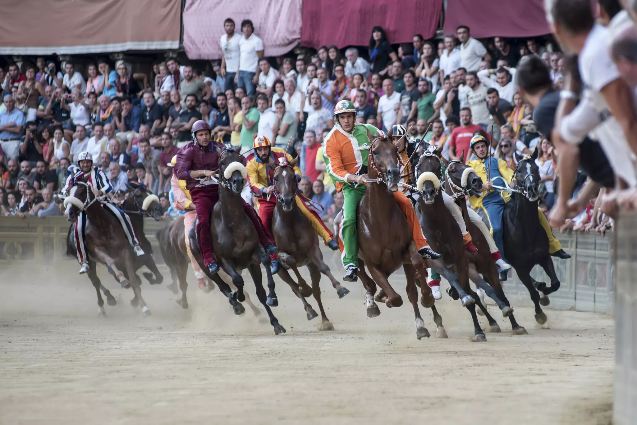 It's worth braving the summer crowds to watch the Palio horse race in central Siena. Getty Images