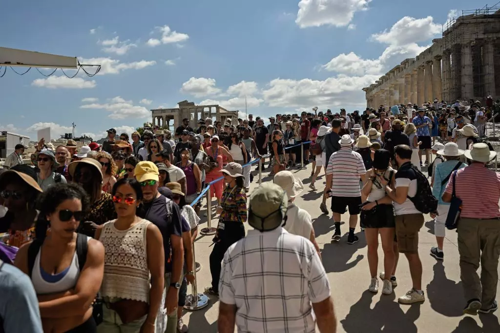 Tourists queue at Propylaia, the Acropolis’ ancient gate  © Louisa Gouliamaki / AFP via Getty Images