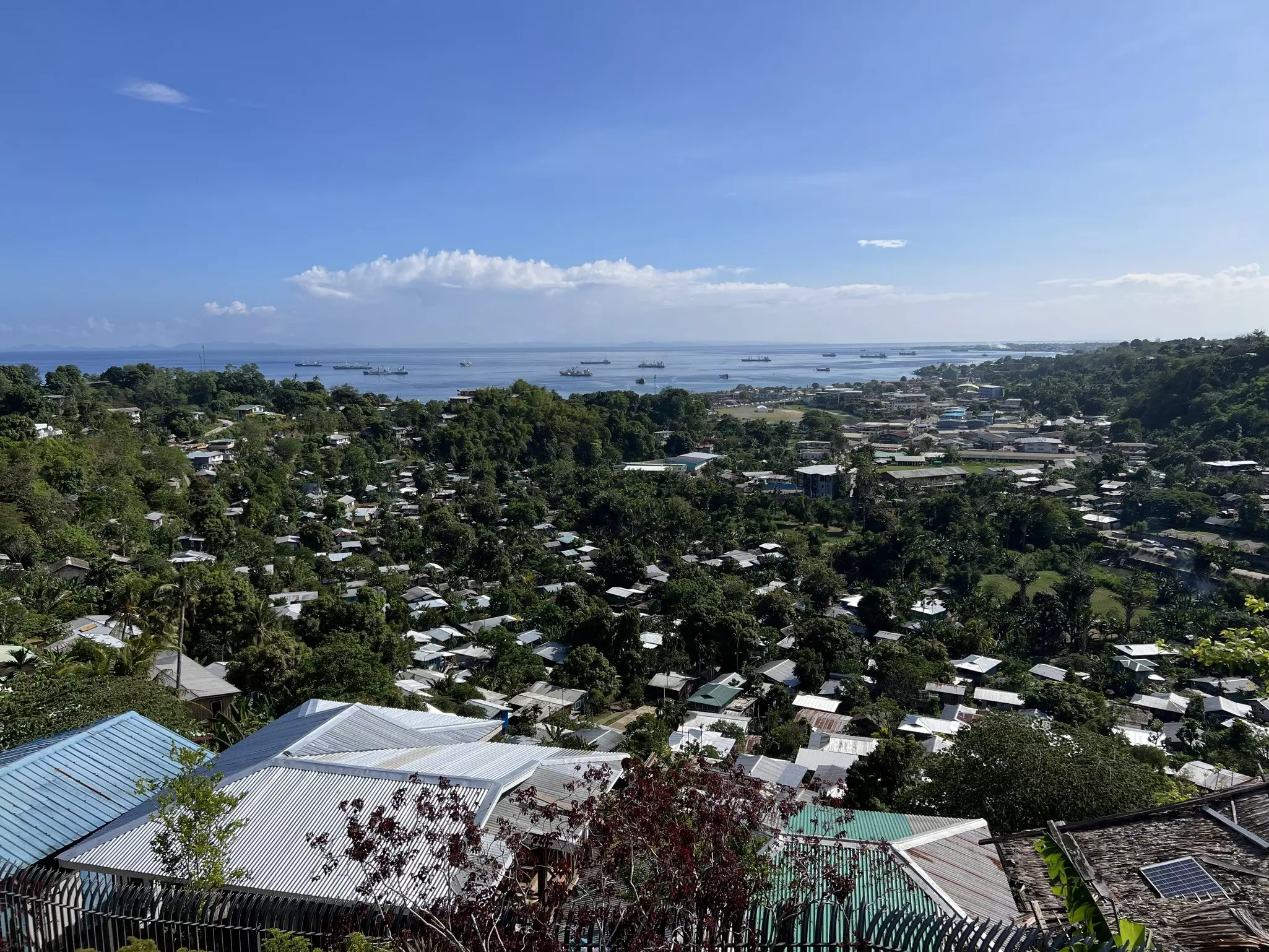 A small low-rise town spreads out on the land towards the coast