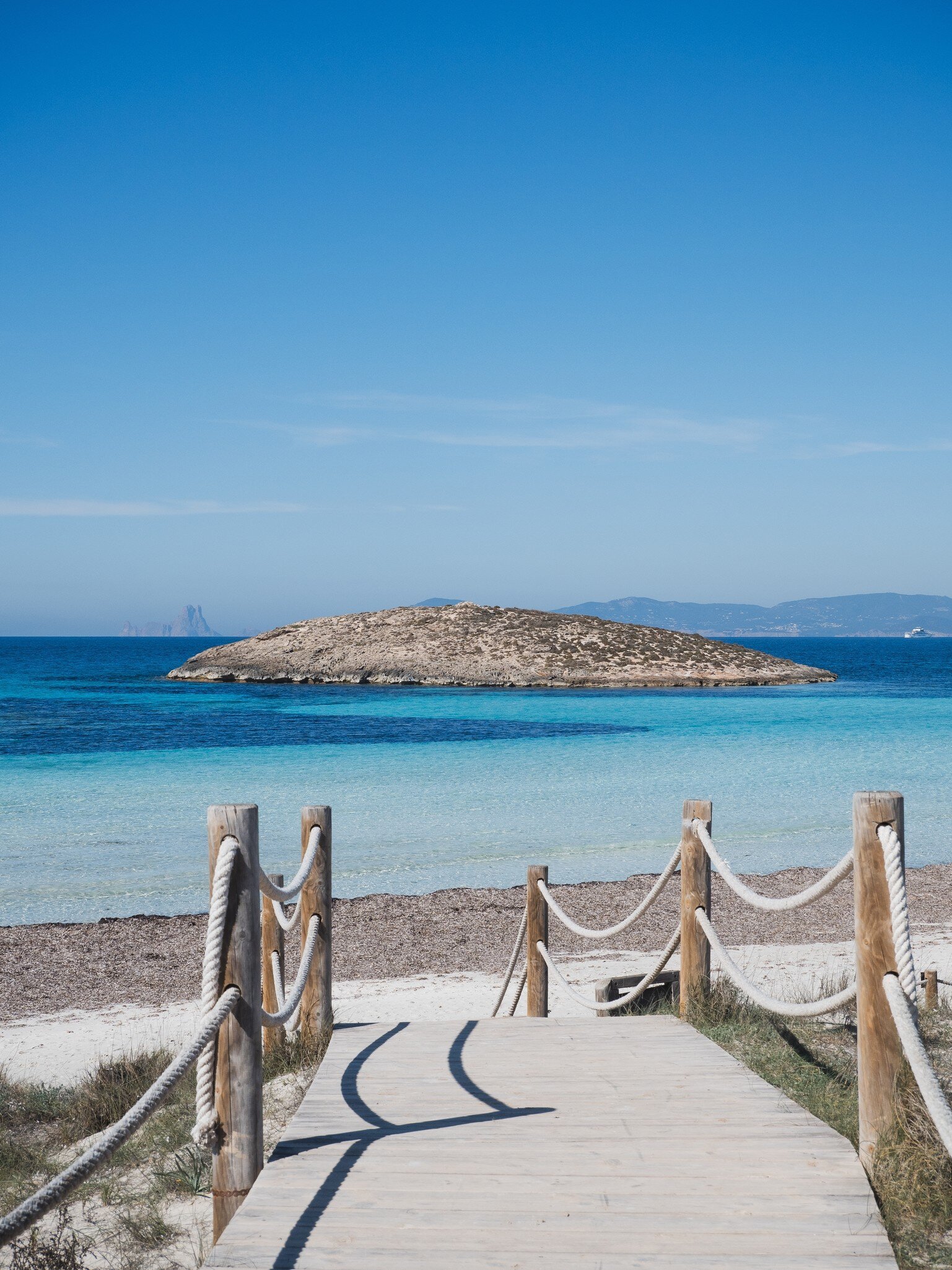 View of an islet from Platja Illetes on the island of Formentera in Spain.