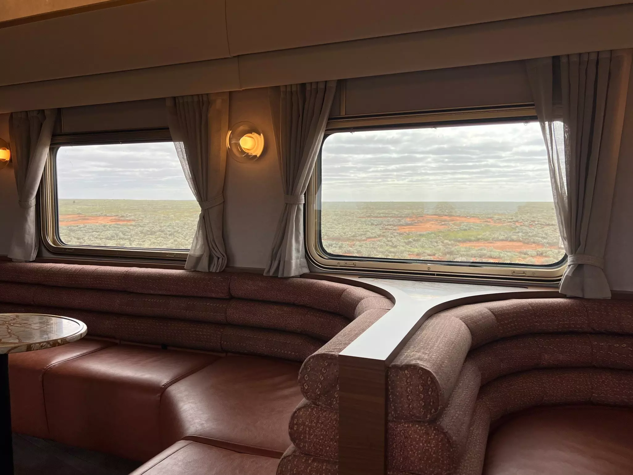 The club car aboard the Indian Pacific Train as the train crosses the treeless Nullarbor Plain.