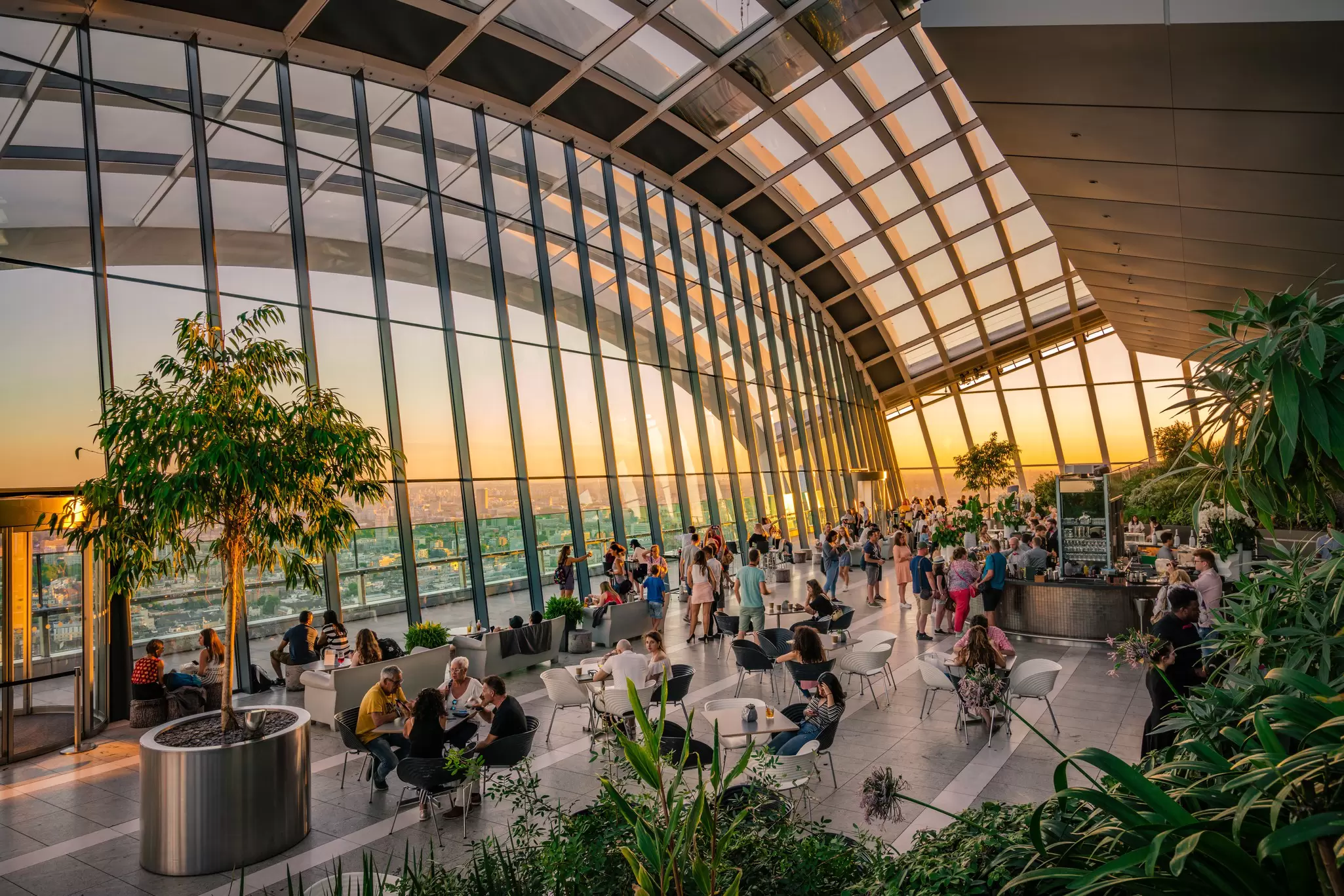 Visitors by the bar at Sky Garden in London, UK.