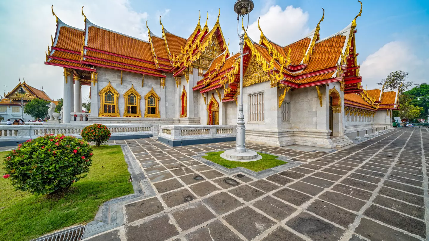A picture of Bangkok's palace illuminated at night