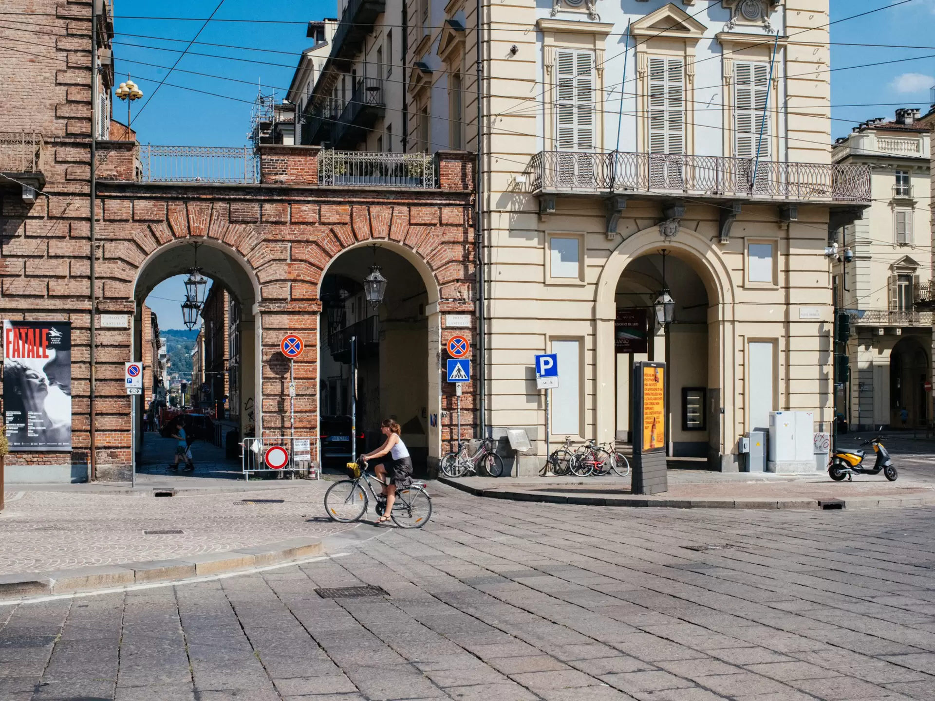 A cyclists rides through an empty square in Turin, Italy. 