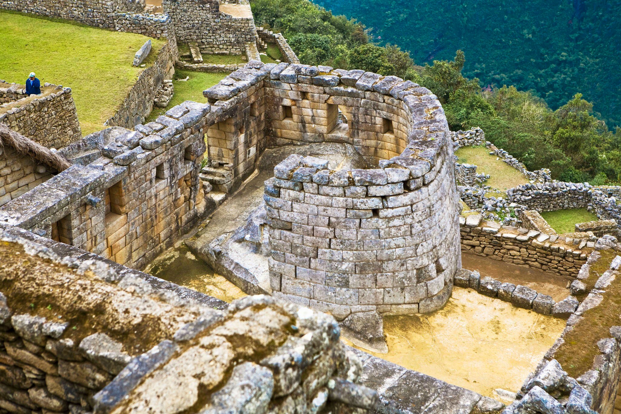 High angle view of the ruins of the circular Temple of The Sun in Machu Picchu, Urubamba Valley, Cuzco, Peru.